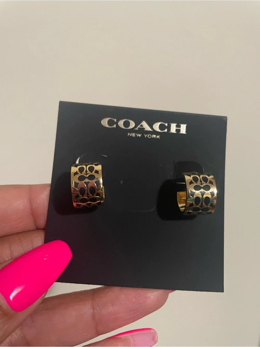 Coach gold tone
